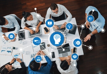 Poster - Engaging top-down view of a diverse team collaborating in a modern workspace, showcasing artificial intelligence concepts and digital technologies for innovative brainstorming sessions. Amity