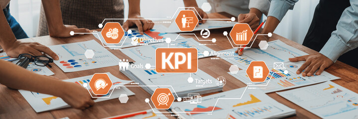 Fototapete - A team collaborates over charts and graphs while analyzing key performance indicators (KPI) at a modern office desk. Ideal for business analysis visuals. Amity