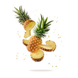 Fresh ripe tropical fruit pineapple and slices with juice drops flying isolated on yellow color background.