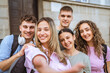 © Miljan Živković - group of happy classmates take a self portrait and in front of school