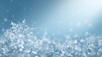 Wall Mural - White snowflakes scattered on a vibrant blue background with bright glowing light, winter holiday theme.
