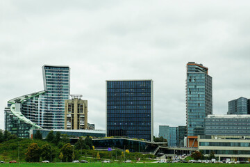 Wall Mural - View of modern skyscrapers in city on cloudy day