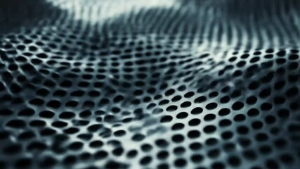 Wavy perforated surface in monochrome
