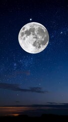 Wall Mural - Full moon shining brightly in the night sky with twinkling stars and dark silhouette mountains in the distance.