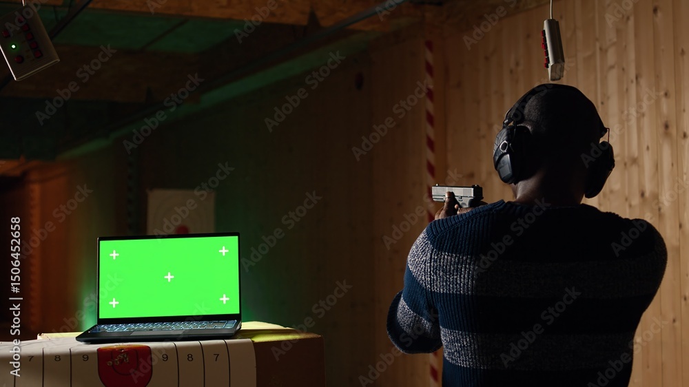 Foto de Stock Chroma key notebook and shooting range customer reloading ...