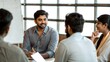 © Jo - Mixed Ethnicity Professionals with Indian Manager in Office Planning Session