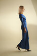 © triocean - Serie of studio photos of female model in elegant royal blue maxi long sleeve off shoulders dress