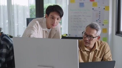 Group of asian senior in a collaborative software development analyzing  flowcharts  during a bootcamp training