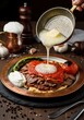 © organik - Traditional Turkish cuisine food iskender kebab with melted butter, sauce, pita bread, tomato, pepper and yogurt.