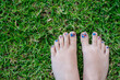 © Austockphoto - painted patriotic toenails on the grass, union jack for UK, Australia or NZ.