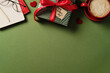 © ADDICTIVE STOCK - Gift, mug, eyeglasses, and notebook arranged on a green background