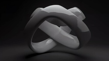 Intersecting Rings Forming Abstract Shape in Dark Environment