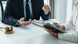 © Freedomz - Male lawyer or notary working consulting and discussion to businesswoman client in the office, Law and Legal services concept