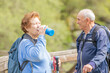© carballo - senior couple hiking outdoors in nature