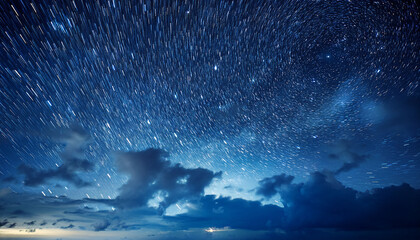 Wall Mural - dark blue night sky with white stars and clouds