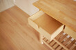 © Towfiqu Barbhuiya  - Wood kitchen drawer partially open on a light floor
