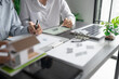 © Charlie's - Solar panels green energy Business man working green eco friendly office business creative idea Planing Bio economy for business eco friendly professional Engineer sustainable electricity.