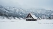 © AnilaStudio - 雪が積もる合掌造りの集落と山々の冬景色