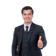 © suphaporn - Confident businessman in formal black suit giving thumbs up gesture, smiling and standing, isolated on a transparent background, representing success, approval, positivity, and professionalism