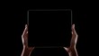 © Oleksandr - iPad In Hands. Female Using Tablet for Business Application on Clean Black Background