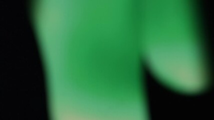 Wall Mural - abstract gradient background as liquid blurred effects. green and dark dominance with light glow eff