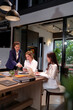 © Pichsakul - Asian Businesswomen Meeting Teamwork Collaboration in Modern Office Brainstorming Strategy Planning Discussing Project on Laptop Analyzing Data Charts for Success