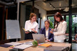 © Pichsakul - Asian Women Teamwork Meeting for Business Plan Presentation Group of Young Professionals Brainstorming Strategy in Modern Office for Marketing