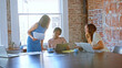 © Monkey Business - Multi-Cultural Group Of Businesswomen Working Together In Boardroom