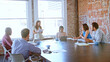 © Monkey Business - Businesswoman Leading Meeting With Colleagues In Boardroom