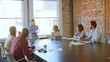 © Monkey Business - Businessman Leading Meeting With Colleagues In Boardroom