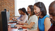 © Monkey Business - Multi-Cultural Business Team Wearing Headsets Working In Busy Customer Service Department