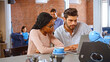 © Monkey Business - Businessman and Businesswoman Have Informal Meeting In Office Coffee Bar