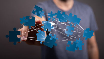 Leinwandbilder - Abstract image of puzzle pieces connecting, symbolizing teamwork, collaboration, and problem-solving.