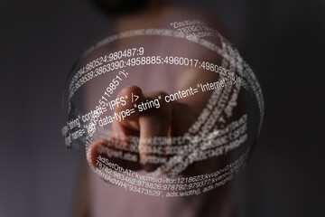 Aufkleber - Abstract image of a person interacting with a futuristic holographic display showing lines of code.