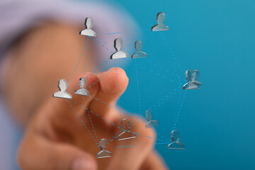 Aufkleber - Image of a hand interacting with a digital network of people, representing global collaboration and connection.