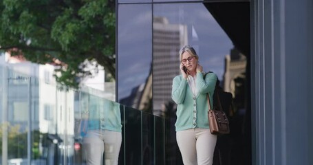 Aufkleber - Business, woman and watch with phone call in city for discussion, planning and schedule appointment. Female person, mobile and check time for travel delay, corporate chat and wait for metro transport