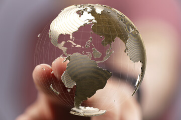 Fototapete - High-quality image of a person interacting with a digital globe, perfect for illustrating global business, technology, and networking.
