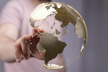 Fototapete - High-quality stock photo of a hand interacting with a 3D model of the Earth, representing global connectivity and technology.
