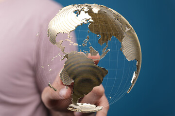 Fototapete - Person interacts with a digital globe, representing global connectivity and networking.