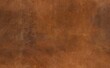 © omkuhh - Rich, textured brown leather background with subtle variations in tone and visible scratches, suggesting age and wear