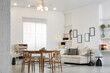 © New Africa - Table, chairs and comfortable sofa indoors. Interior design