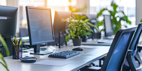 Fototapete - Modern desk setup with digital tools, greenery, and clean design elements in a contemporary office.