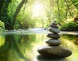 © Donald - calm river with stacked stones surrounded by lush greenery reflecting tranquil and zen atmosphere concept of balance and harmony spa meditation relaxation wellness nature background
