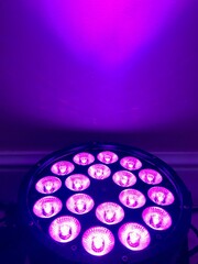 Wall Mural - purple light from a spotlight reflects on the wall