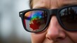 © Atralia13 - Reflection of canadian pride sunglasses with maple leaf outdoor setting lifestyle photography natural light