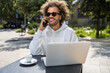 © ADDICTIVE STOCK - Businessman enjoying a phone call at an outdoor cafe table