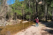 © ADDICTIVE STOCK CORE - Young Asian woman enjoying nature at Nacimiento Rio Mundo, Spain