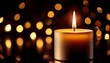 © Stella - a single burning candle with a soft golden glow placed against a dark black background with subtle bokeh light effects