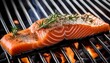 © Patti - a succulent piece of salmon seasoned and grilling on a hot barbecue creating delicious smoky aromas the fish is cooked to perfection glistening under the heat