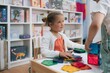 © Marcos - Children playing with magnetic tiles in toy store developing creativity